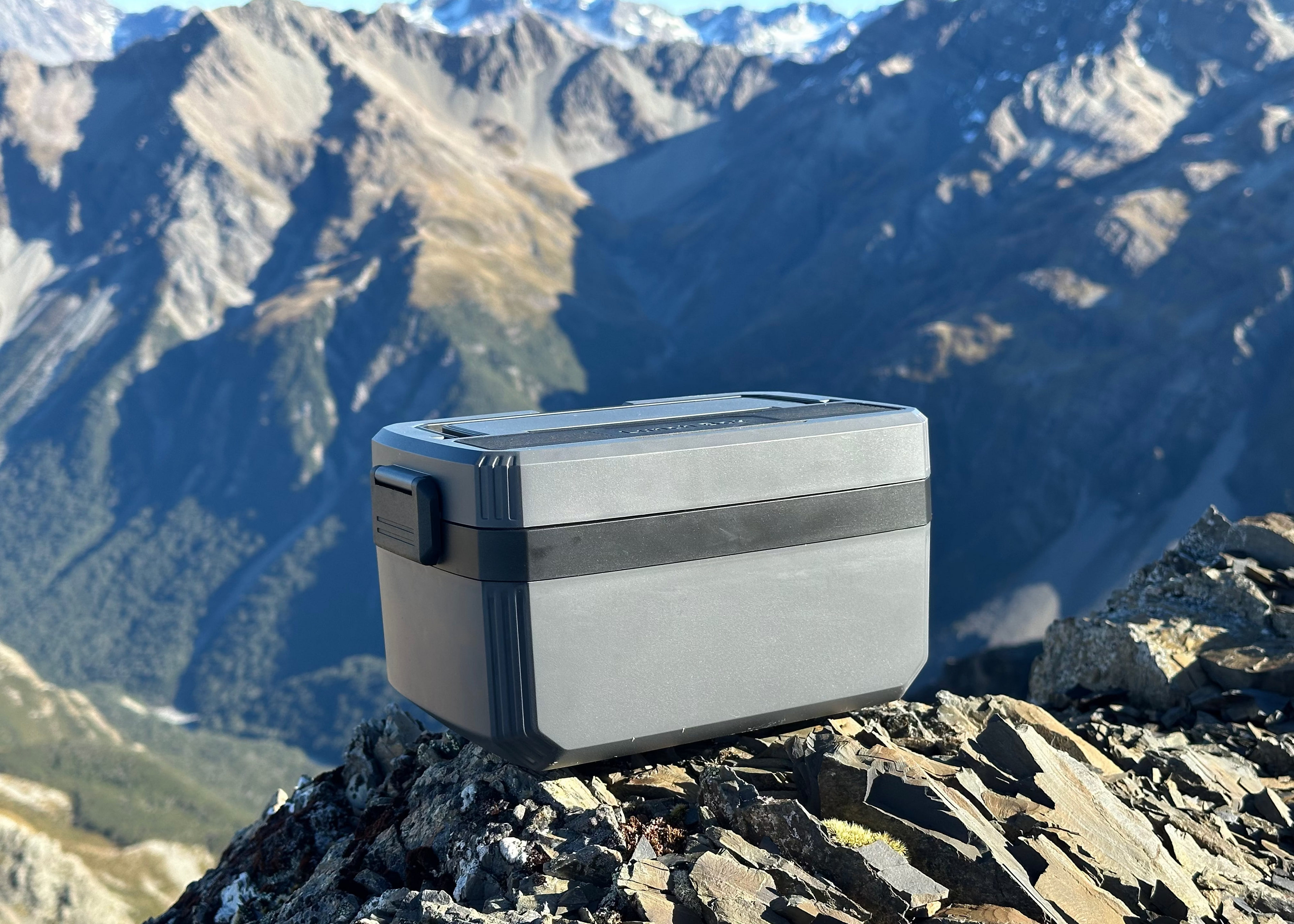 Norva Wireless Heated Lunchbox at summit of mountain. 